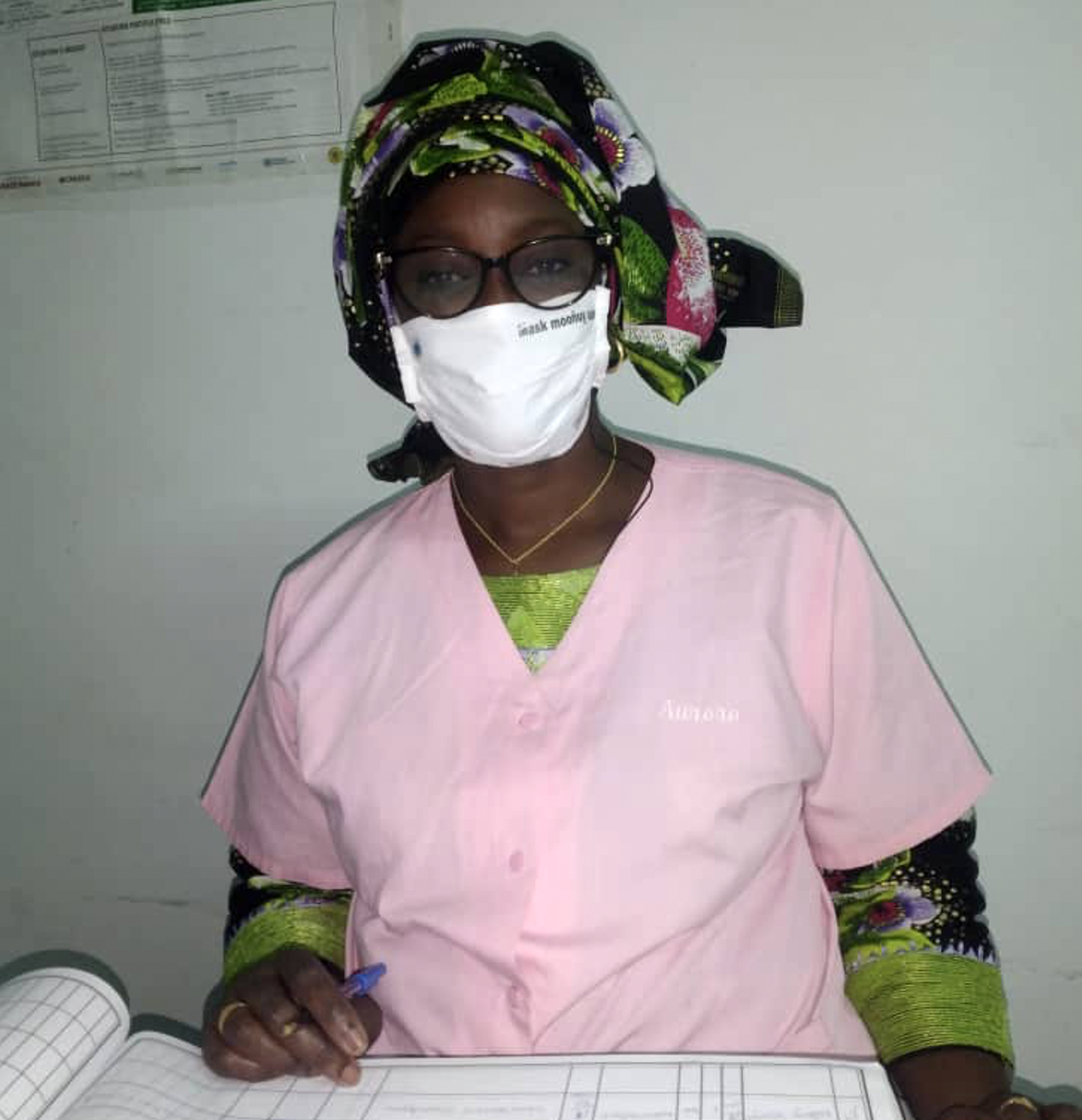 Author's photo—she wears pink scrubs and a mask