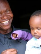 Grandmother in Guinea with a baby