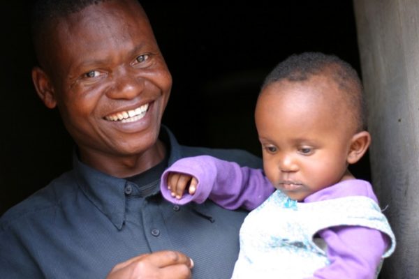 Grandmother in Guinea with a baby